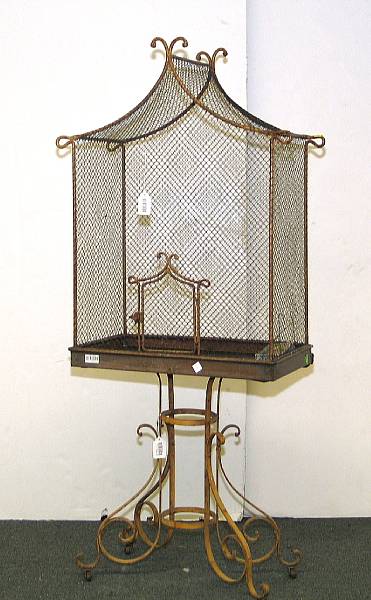 Appraisal: A yellow painted wire work and iron birdcage on stand