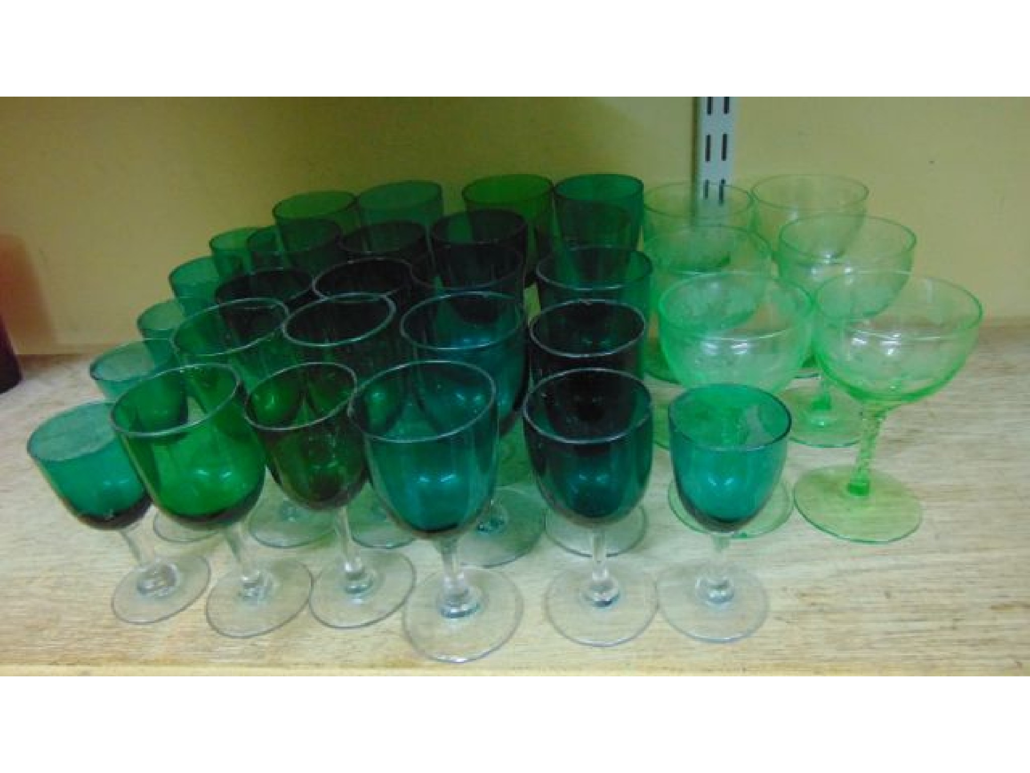 Appraisal: Approximately twenty five wine glasses with green bowls raised on