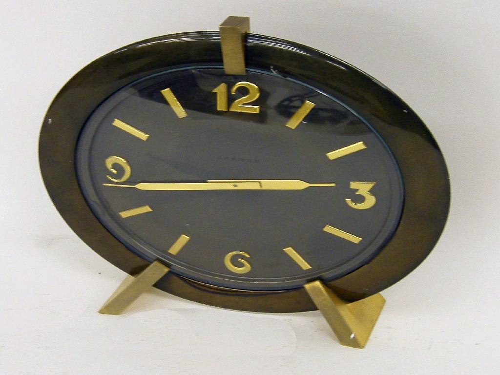 Appraisal: Attento double dial electric ceiling hung clock within a cream