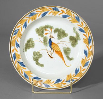 Appraisal: Pearlware peafowl plate peacock perched in green-sponged tree blue and