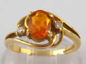 Appraisal: An carat gold fire opal and diamond ring opal approx