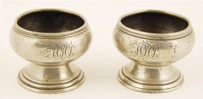 Appraisal: A pair of George I pewter circular stem salts with