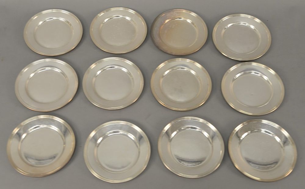 Appraisal: Set of twelve sterling silver bread plates marked Fisher diameter