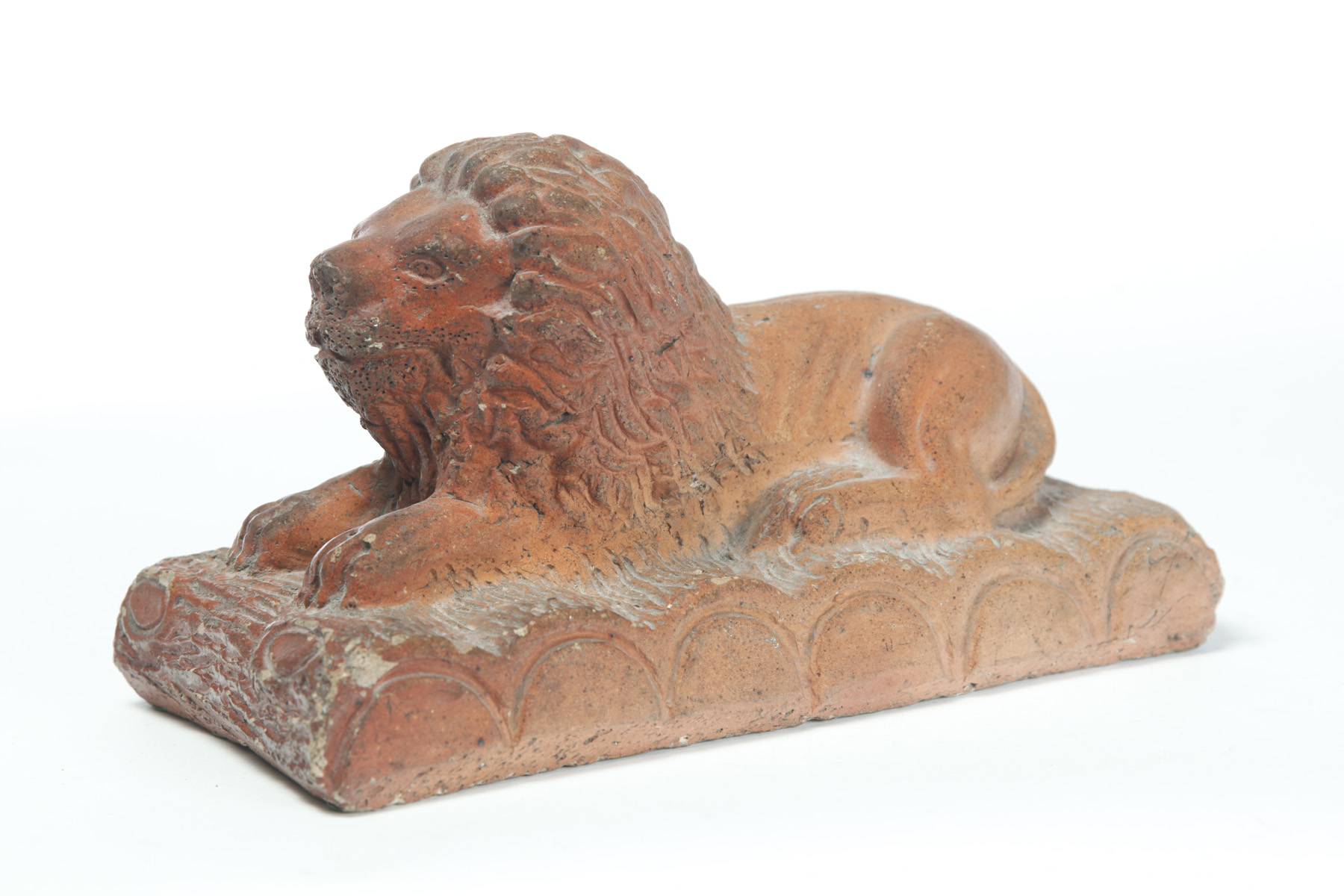 Appraisal: AMERICAN SEWERTILE LION First half- th century Reclining lion on