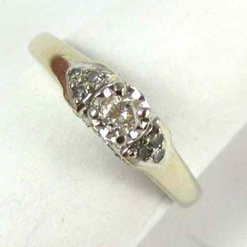 Appraisal: DIAMOND AND TEN KARAT WHITE GOLD RING set with a