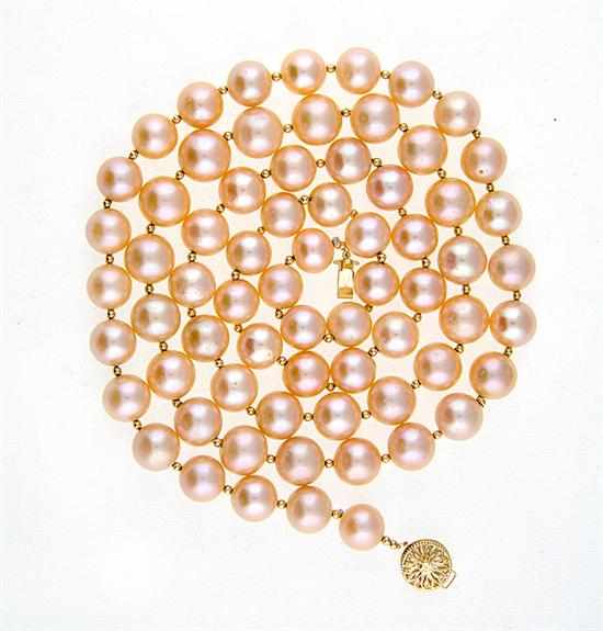 Appraisal: South Sea peach pearl necklace with gold clasp strand of