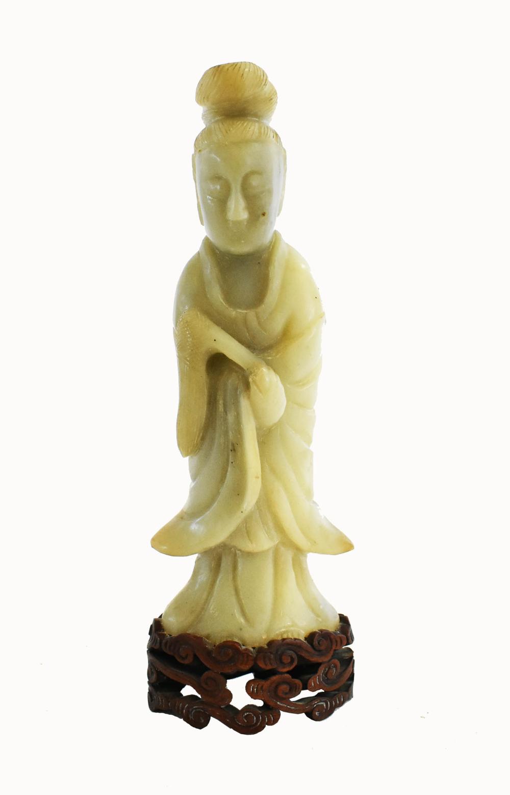 Appraisal: CHINESE PALE CELADON JADE FIGURE F QUANYINThe standing deity in