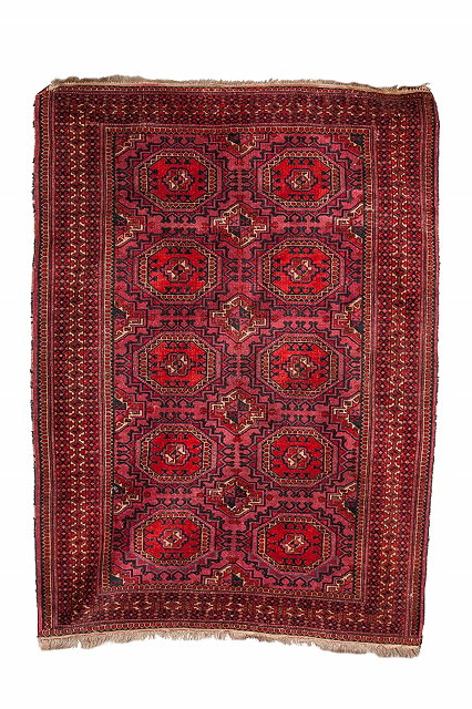 Appraisal: AN OLD TURKOMAN BOKHARA RUG decorated two rows of octagonal