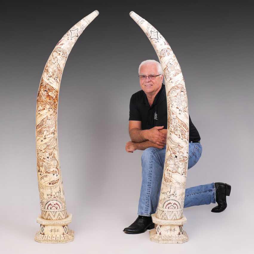 Appraisal: PAIR OF CHINESE CARVED BONE CLAD TUSKS Mirror image pair