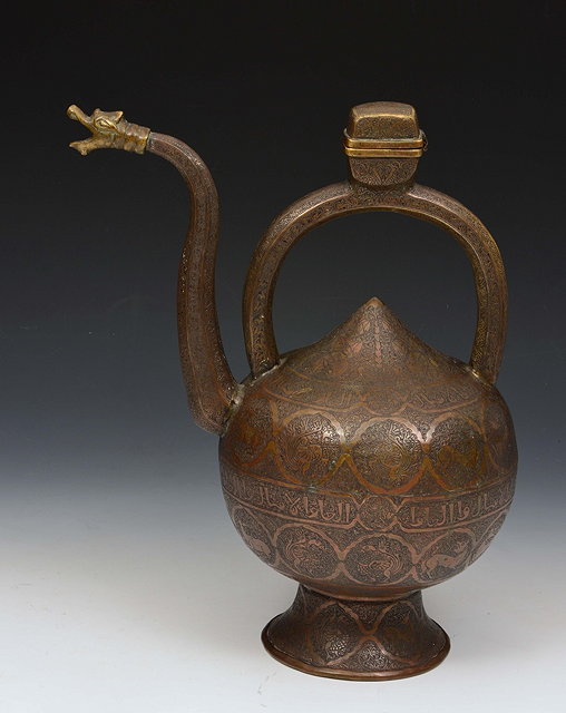 Appraisal: A BRONZE EWER Iran or Deccan the body of onion