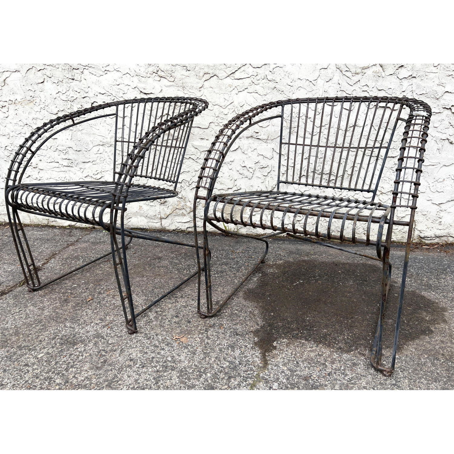 Appraisal: Pr Modernist Iron Outdoor Lounge Chairs Bowed arms Cantilever base