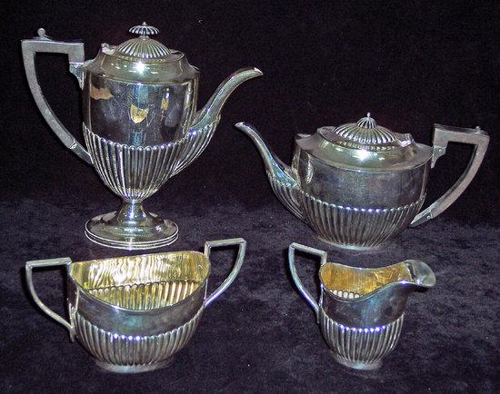 Appraisal: An oval half ribbed tea service with thread borders comprising