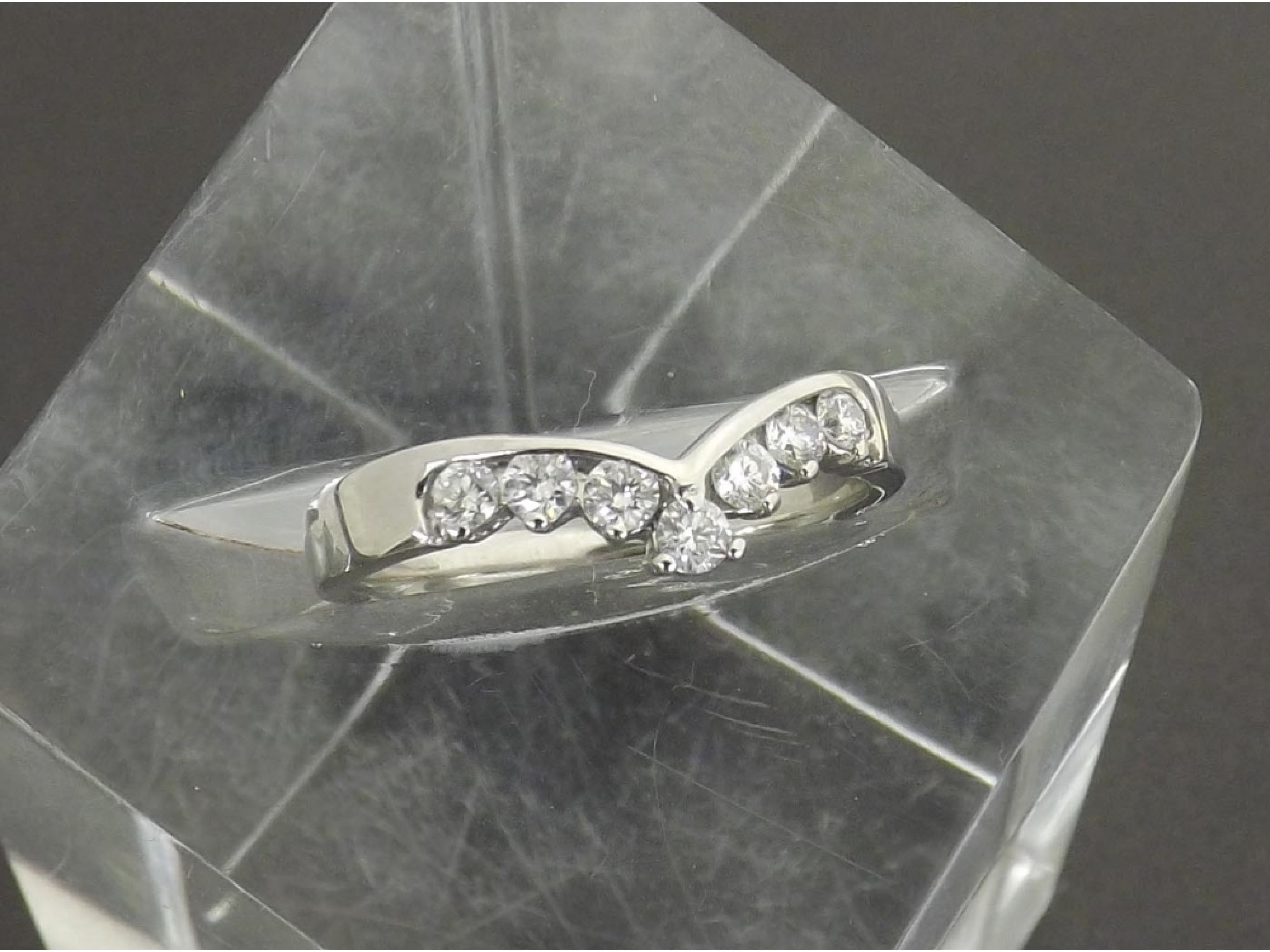 Appraisal: - -a ct white gold seven stone diamond wishbone ring