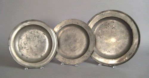 Appraisal: Three pewter chargers th th c the largest bearing the