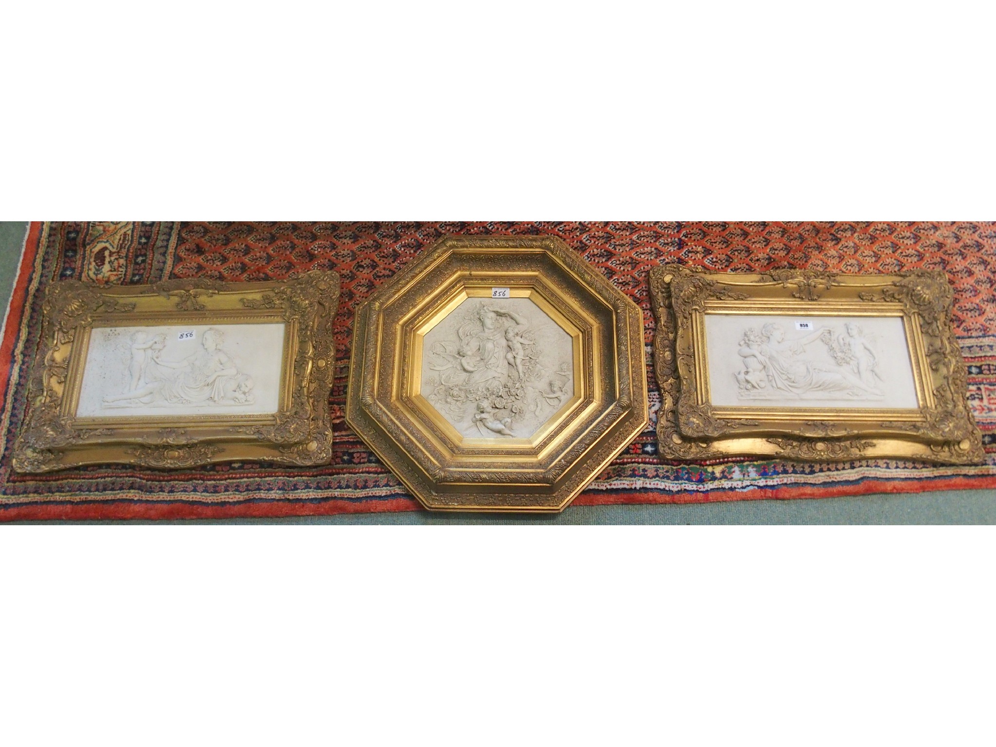 Appraisal: Three gilt framed wall plaques cast with classical maidens