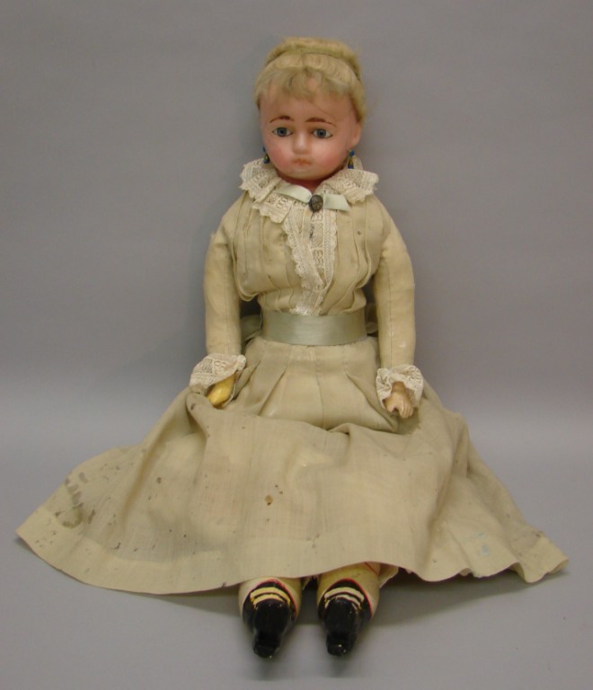 Appraisal: Unmarked wax over papier mache doll with stationary blue eyes