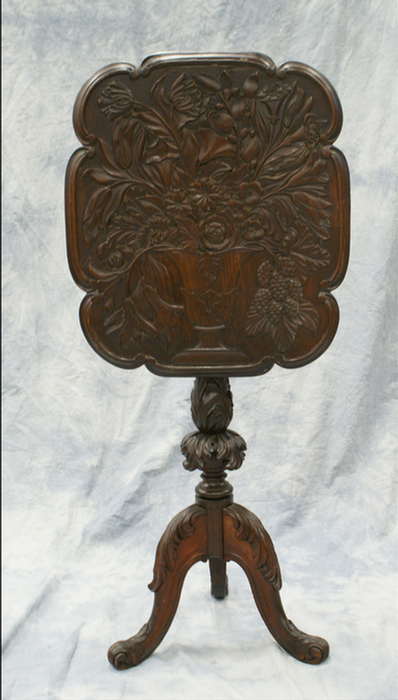 Appraisal: Carved mahogany Fantasy tilt top table top relief carved with