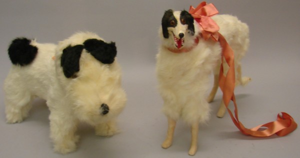 Appraisal: Pair of white fur covered dogs L Terrier with black