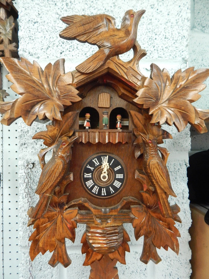 Appraisal: A Black Forest type cuckoo clock mounted with two birds