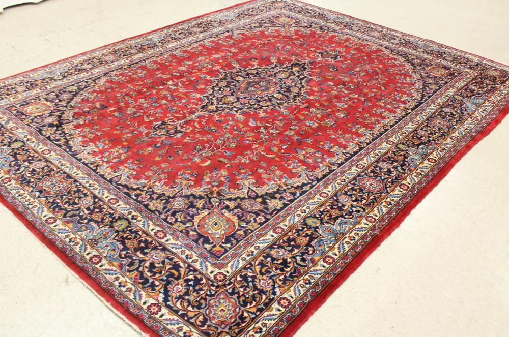 Appraisal: HAND KNOTTED PERSIAN CARPET floral and central floral medallion design