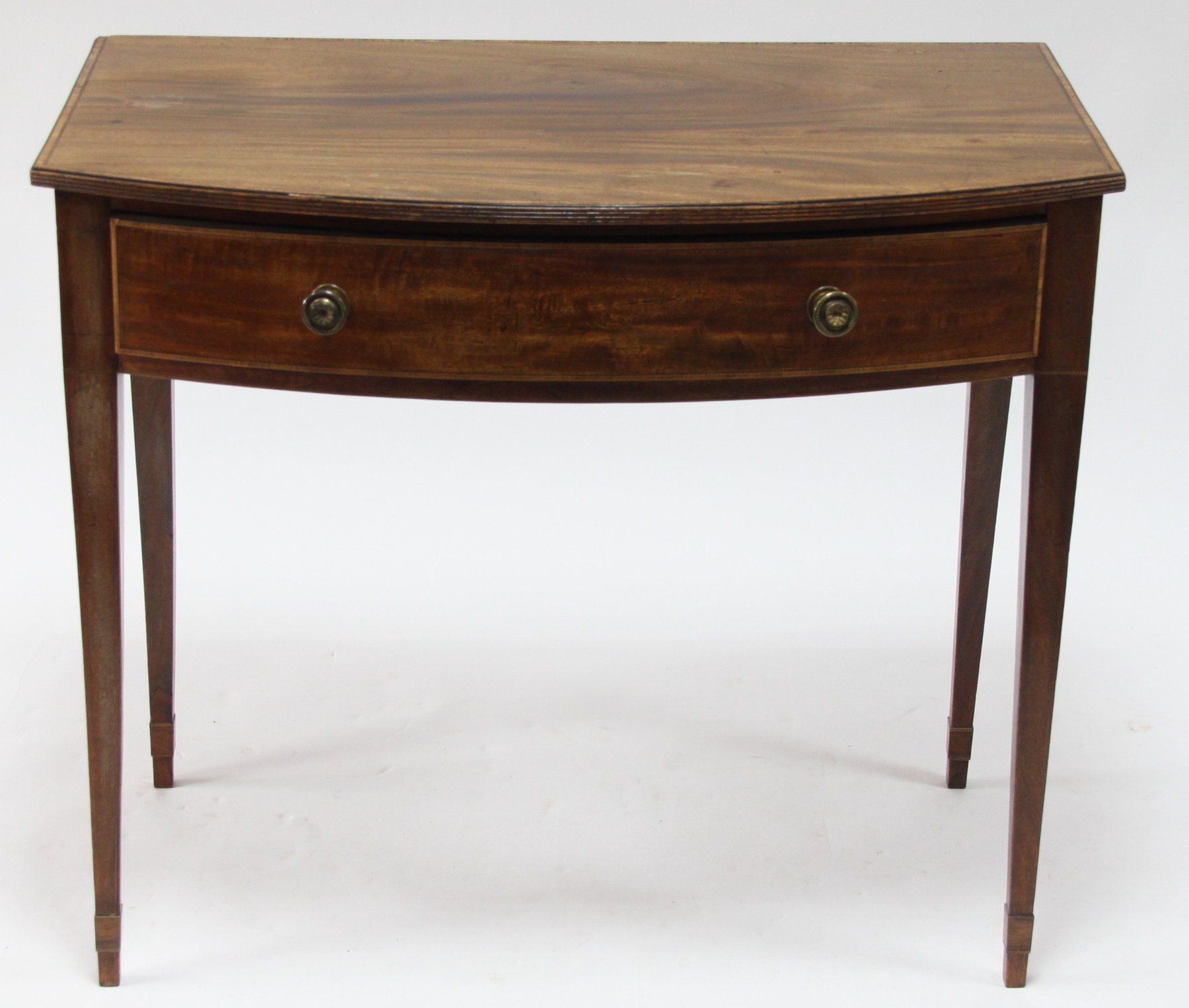 Appraisal: A Regency mahogany bowfront table fitted a drawer on square