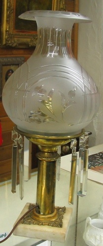 Appraisal: AN ELECTRIFIED TABLE LAMP c The embossed gilt standard on