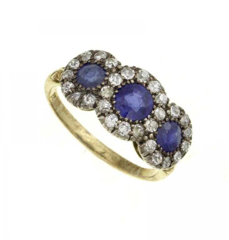 Appraisal: A SAPPHIRE AND DIAMOND TRIPLE CLUSTER RING the three larger