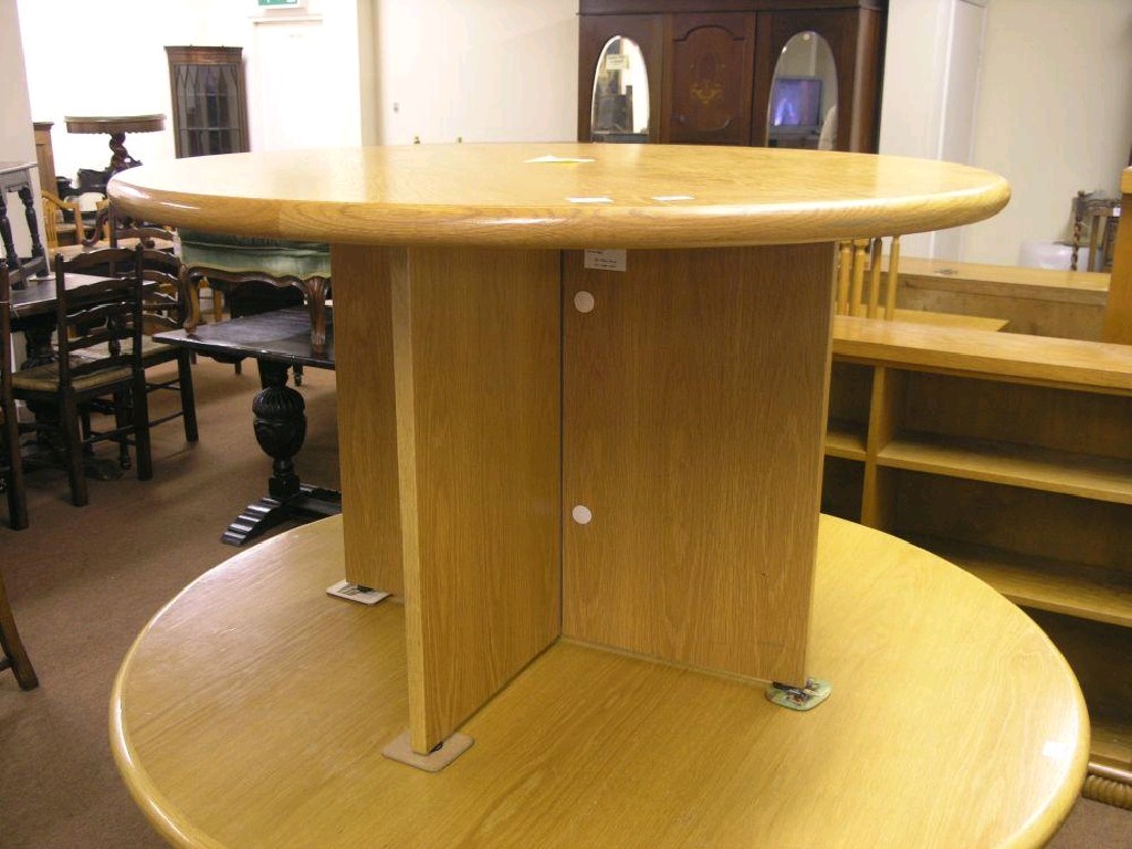 Appraisal: A modern oak circular table on boarded oak frame ft