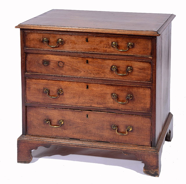 Appraisal: A GEORGE III MAHOGANY STRAIGHT FRONT CHEST of four long