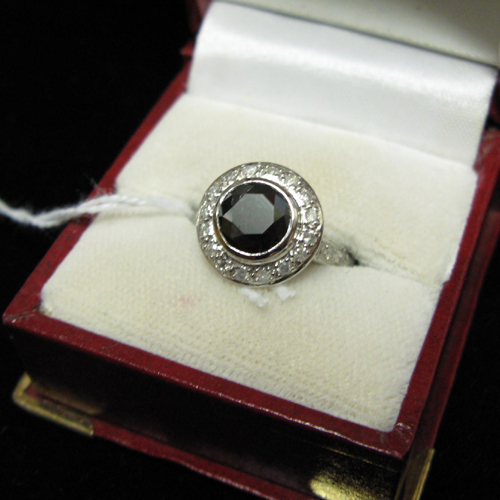 Appraisal: BLACK DIAMOND AND FOURTEEN KARAT WHITE GOLD RING WITH APPRAISAL