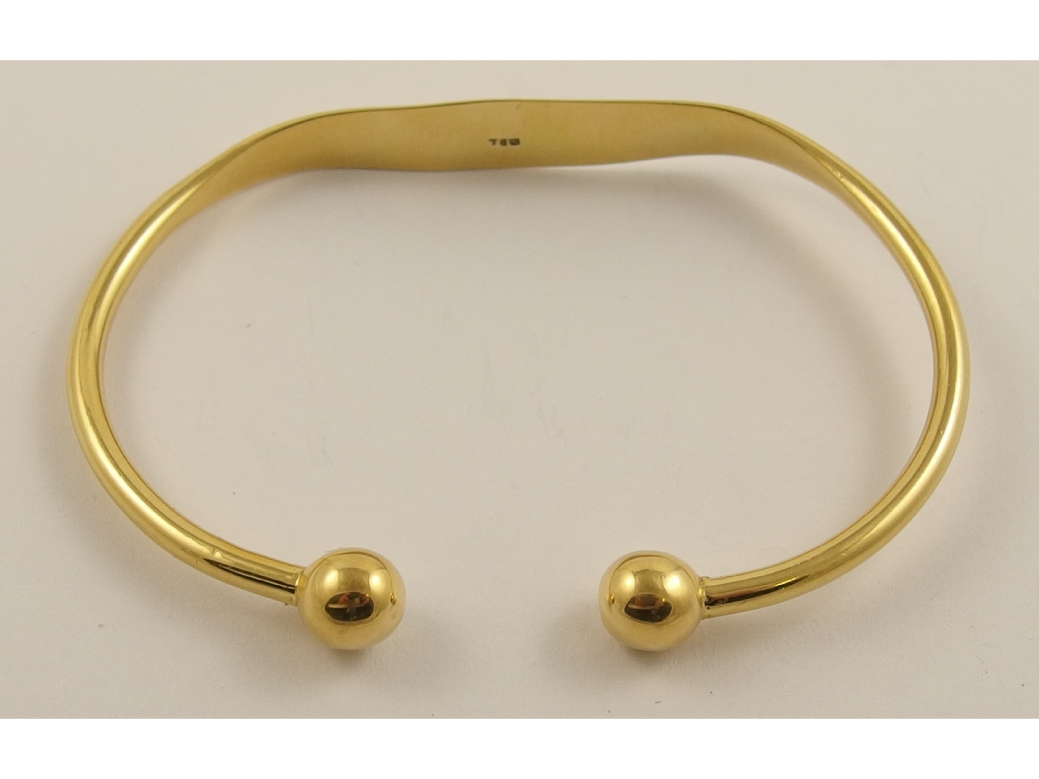 Appraisal: An ct torc shaped bangle weight gms