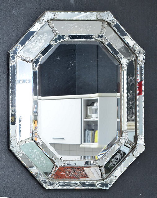 Appraisal: A VENETIAN STYLE ETCHED WALL MIRROR with cushioned frame cm