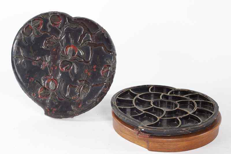 Appraisal: Lidded Chinese Lacquered Sweetmeat BoxQianlong period peach form tete -de-negre