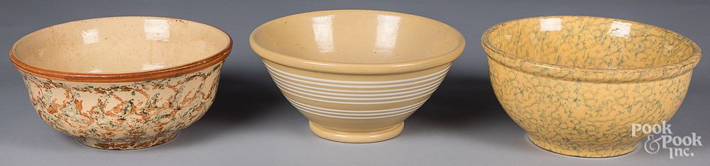 Appraisal: Three yellowware bowls th c Three yellowware bowls th c