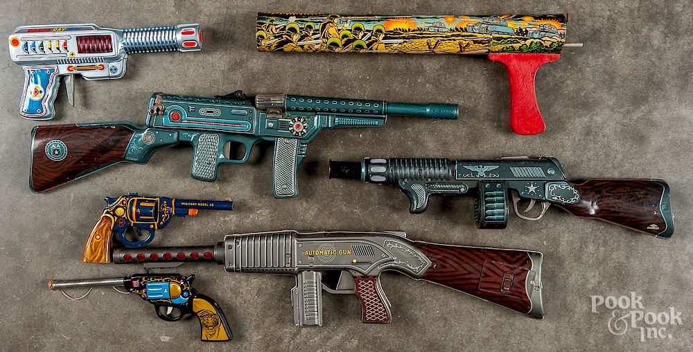 Appraisal: Collection of six tin litho toy guns Collection of six