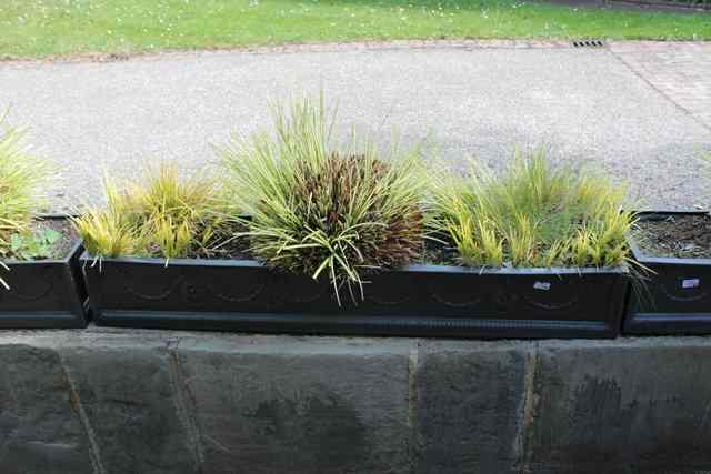 Appraisal: A SET OF FOUR LONG FAUX LEAD TROUGHS with classical