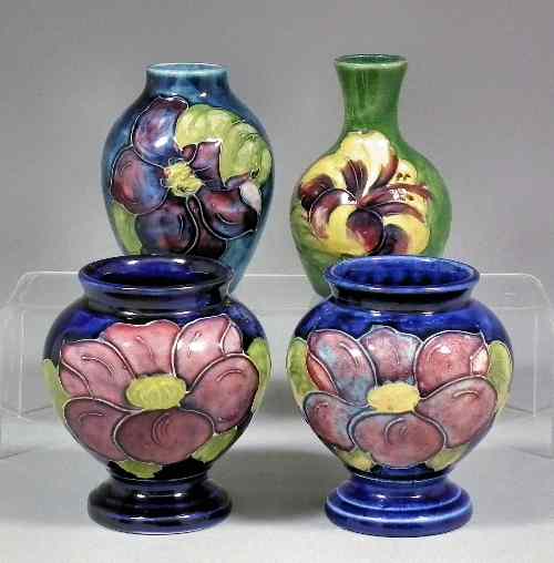 Appraisal: Two Moorcroft pottery baluster shaped vases tube lined and decorated