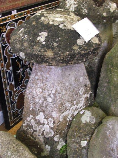 Appraisal: AN ANTIQUE COTSWOLD LIMESTONE STADDLE STONE in two parts on