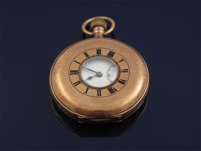 Appraisal: A ct gold half hunting cased pocket watch White enamel