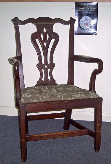 Appraisal: An th Century mahogany armchair with pierced splat back and