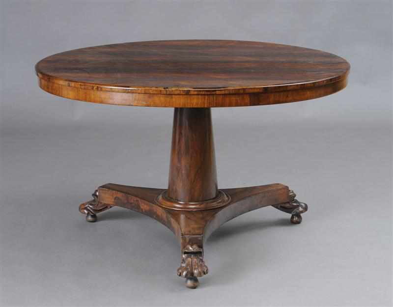 Appraisal: REGENCY ROSEWOOD CENTER TABLE With an overhanging top raised on