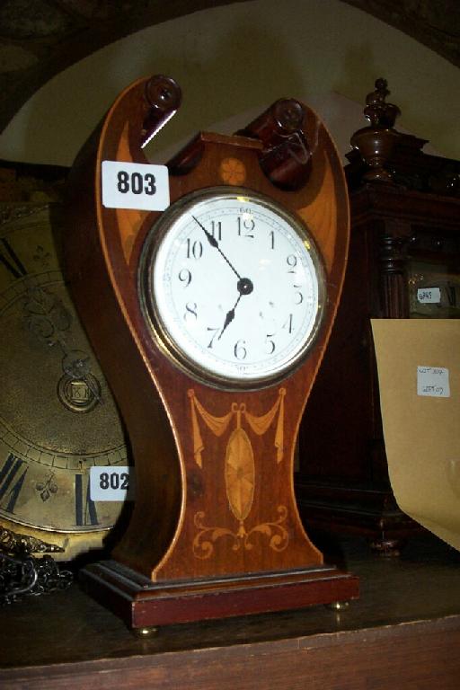 Appraisal: An Edwardian mahogany mantel clock set in a vase shaped