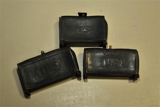 Appraisal: THREE CARTRIDGE BOXES US Military leather and brass fold-out variety