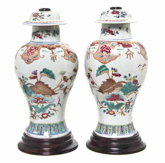 Appraisal: A Pair of Chinese Porcelain Lidded Baluster Vases the domed