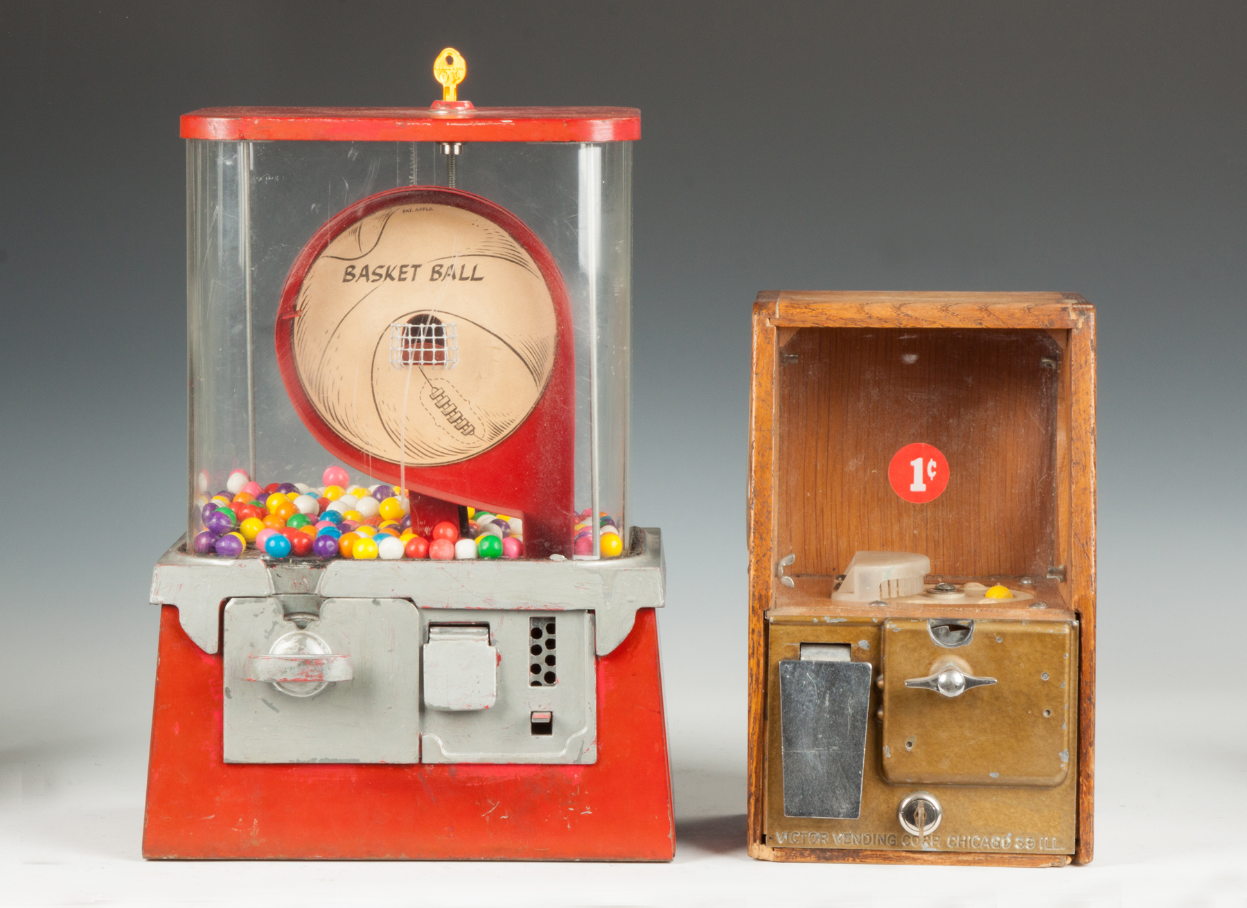 Appraisal: Two Vintage Gumball Machines L Basketball One Cent Bubblegum Machine