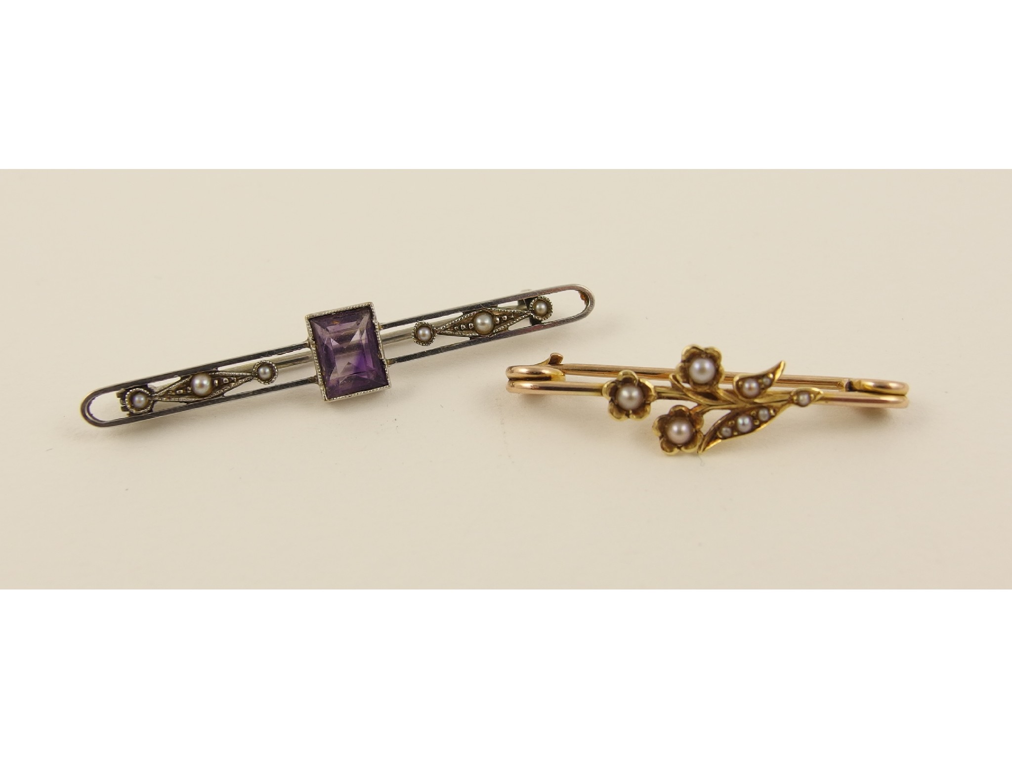 Appraisal: A white metal amethyst and pearl set brooch together with