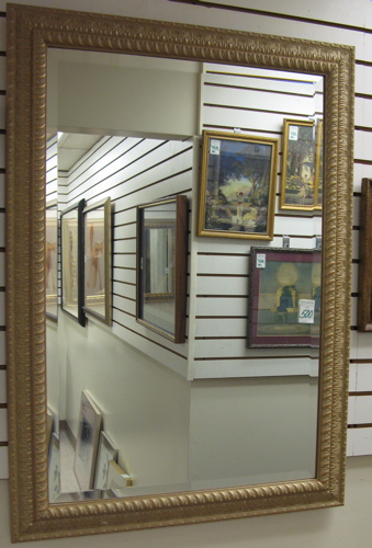 Appraisal: A BEVELED RECTANGULAR WALL MIRROR having a molded wide frame