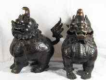 Appraisal: A large pair of Chinese bronze temple incense burners in