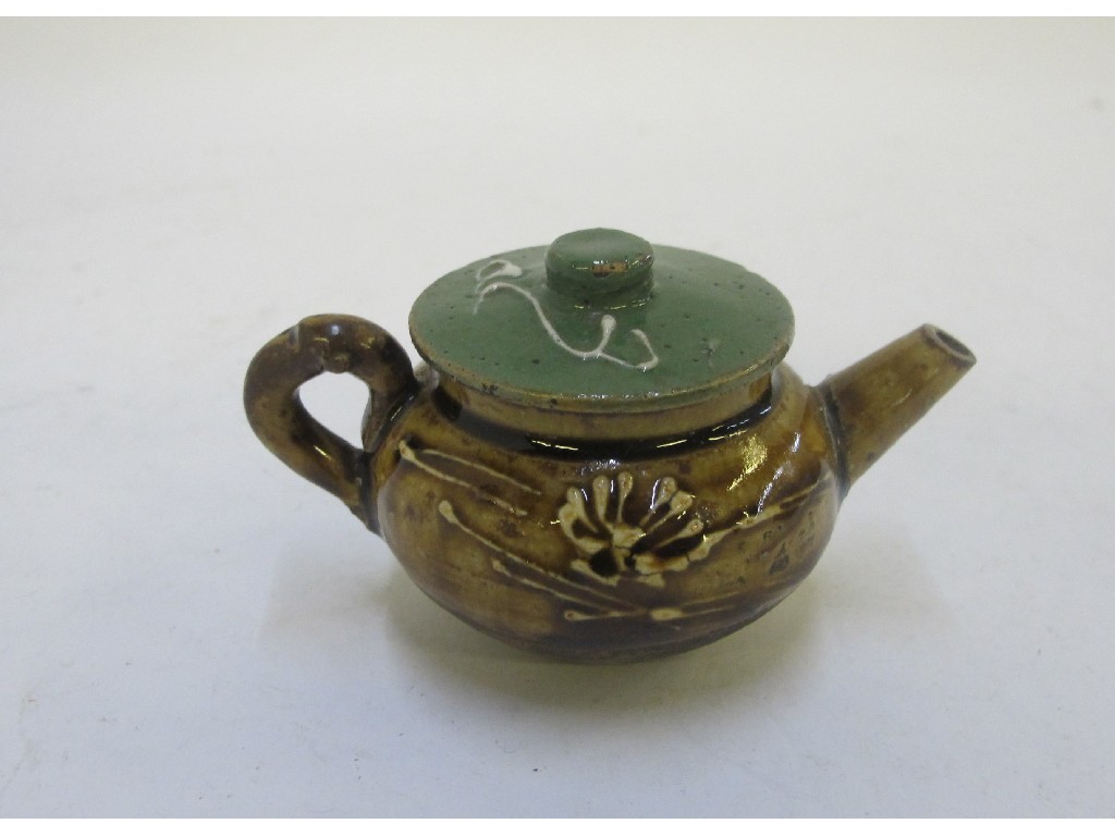 Appraisal: Chinese miniature teapot partially glazed