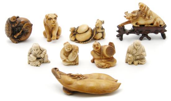 Appraisal: Group of Japanese Ivory Netsuke and Okimono depicting figures and